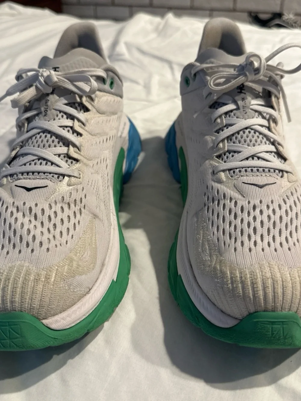 Hoka Men's White Running Shoes with Green and Blue Soles